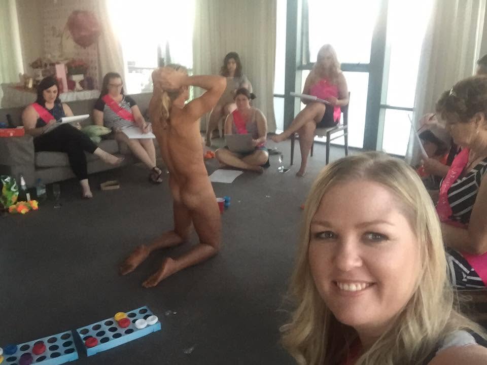 A smiling hen taking a selfie while the group sketches the kneeling model
