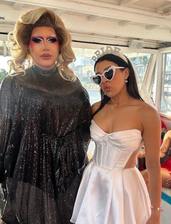 A drag performer and a bride to be on a boat cruise