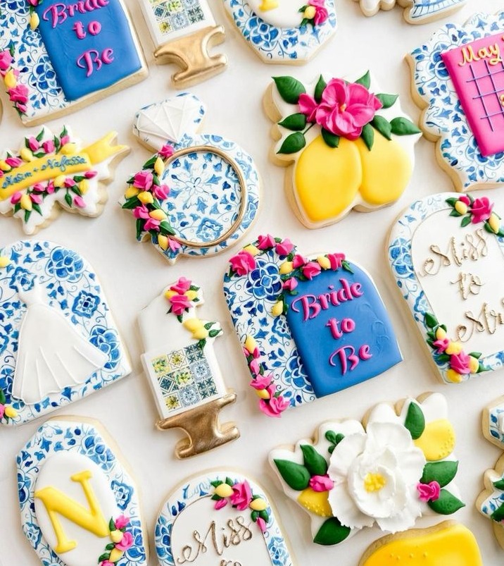Decorated hens biscuits in blue and white tile, lemons and Bride to Be icing