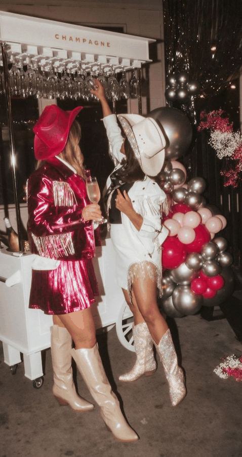 Two friends in pink sequins and white cowboy boots
