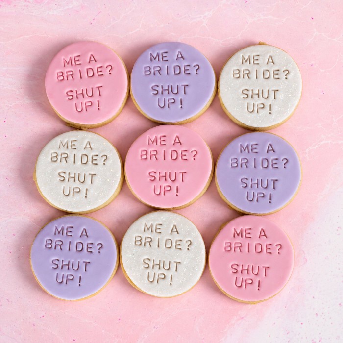 Iced cookies in pink, lilac and white that read Me a bride? Shut up!