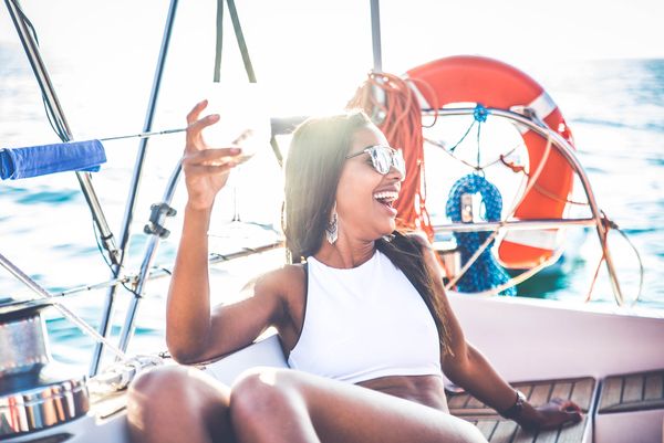 A gorgeous hen holds a champagne glass and enjoys her private hens cruise