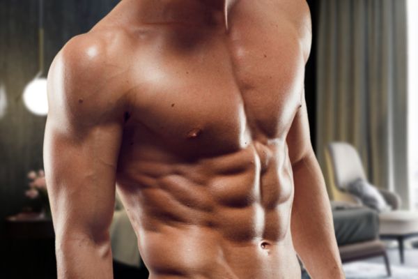 Muscular topless waiter flaunts his flawless abs