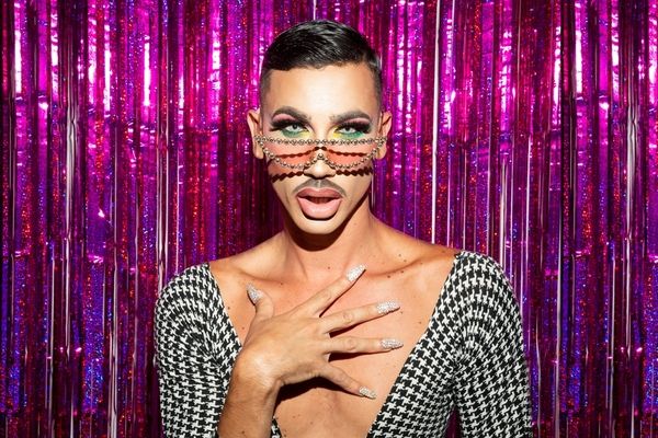 A fabulous drag queen in a stunning low cut top