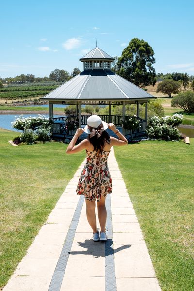 A woman in a sundress at a winery tour