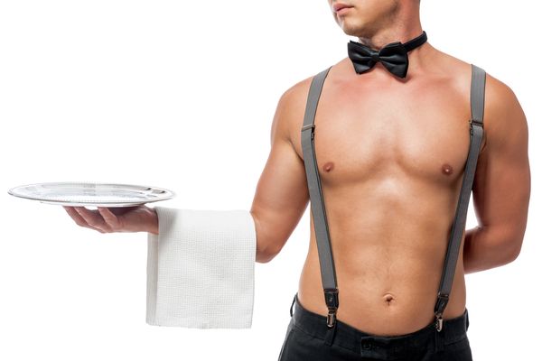 Sexy male topless waitress serving drinks to hens group