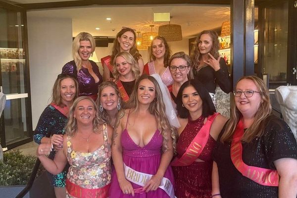 A hens group in sequins and sashes gathers together for a night out