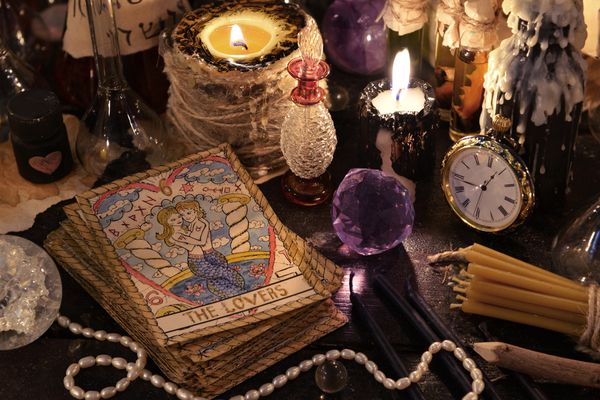 A tarot reader's full suite of crystals and cards