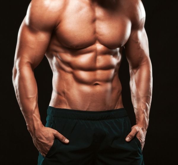 Muscular topless waiter flaunts his flawless abs