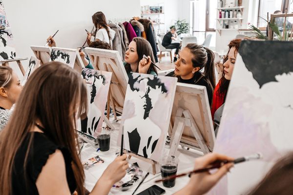 A gorgeous hen attended a painting class in a private studio with her friends and they started painting their artwork