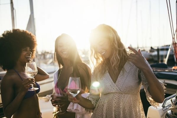 Friends on a cruise on a hens party laughing together