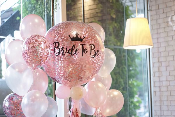 Pink and white balloons with 'Bride to be' written on them