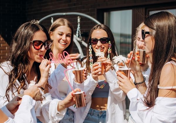 A group of ladies sipping on drinks