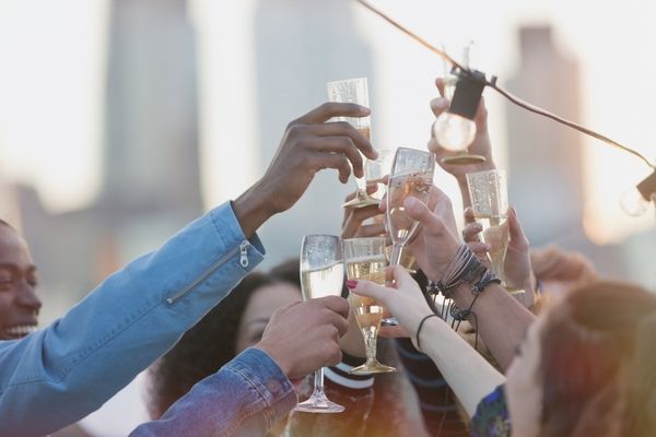 A hens party cheersing to the sky