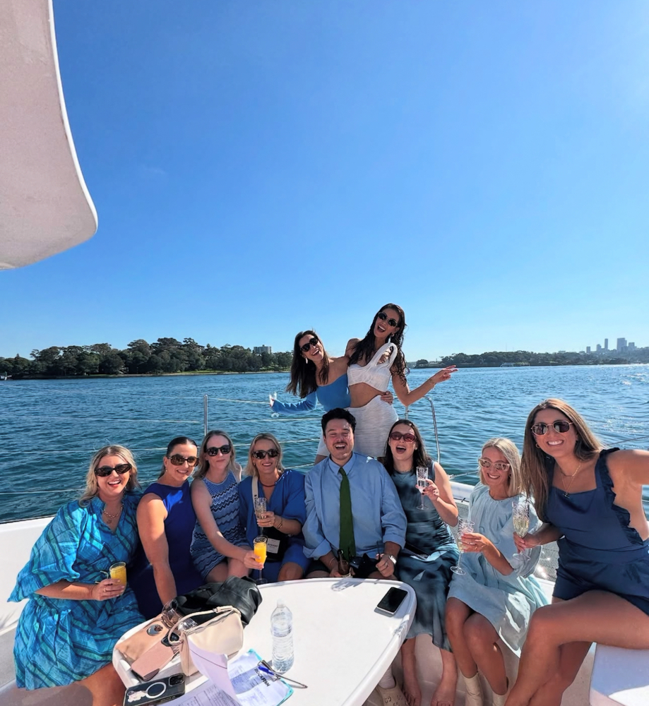 Britt's crew relaxing on the front deck of the catamaran in the sunshine