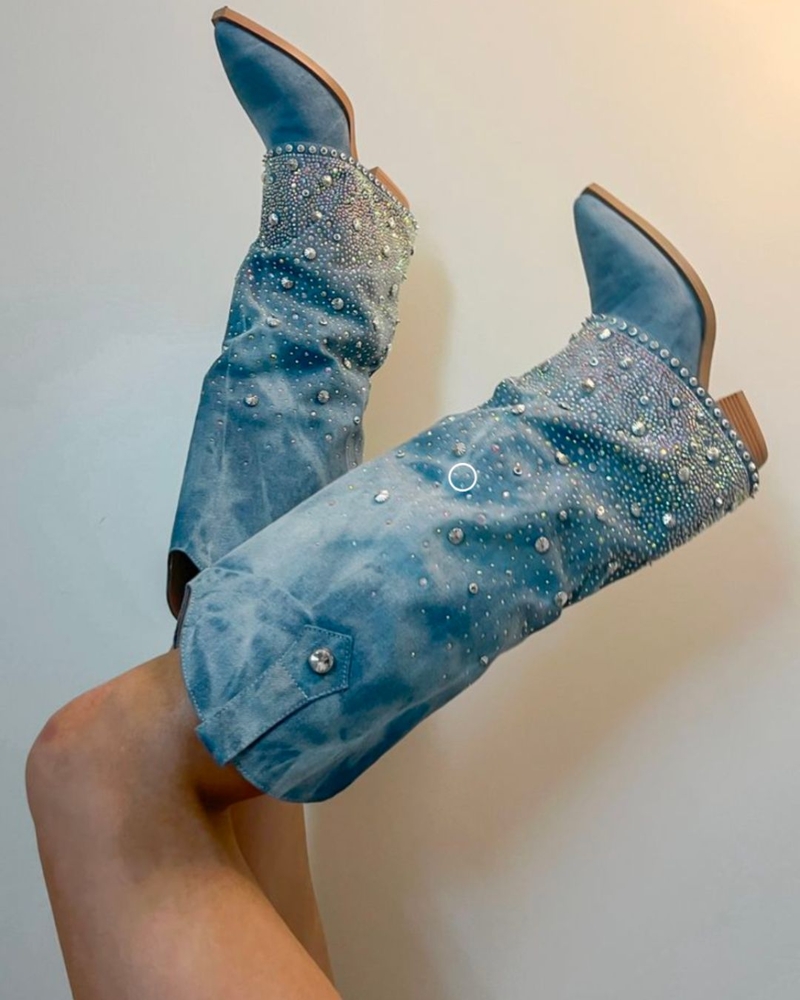 Blue denim cowboy boots covered in rhinestones