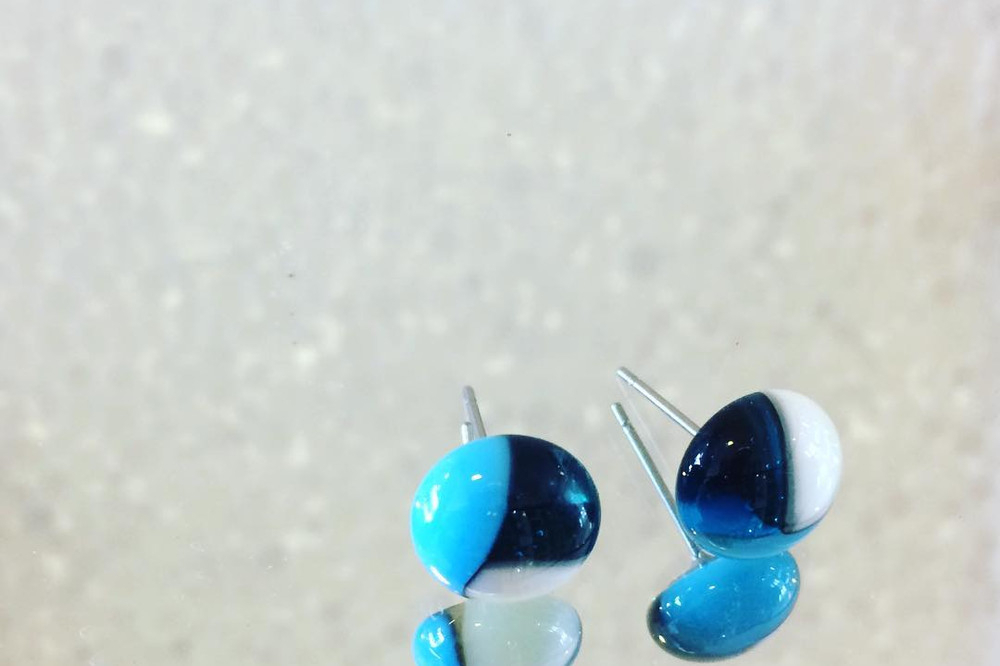 A pair of blue and white fused glass stud earrings