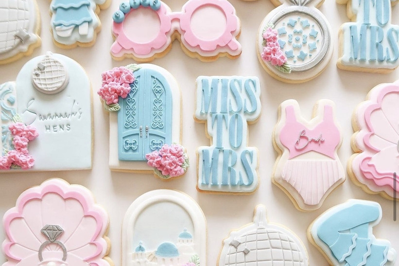 Iced hens cookies with Miss To Mrs, rings, disco balls and bride designs