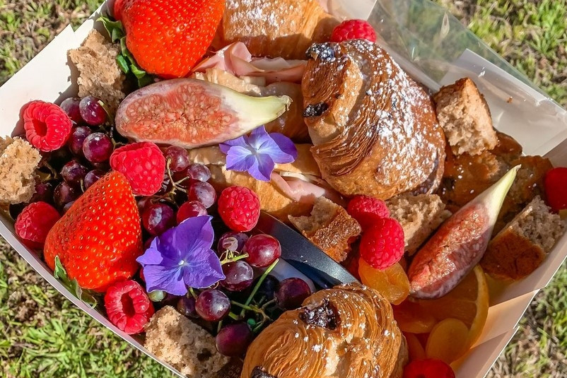 A brunch grazing box of pastries, strawberries, figs and berries