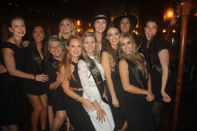 Nataline's hens crew in black posing together on their night out